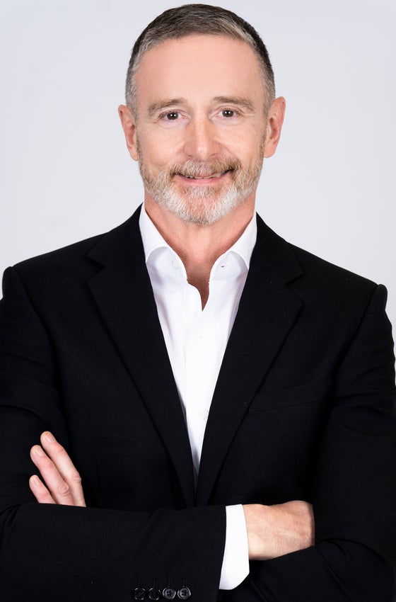 Portrait of Dennis Cusack, Licensed Real Estate Advisor.